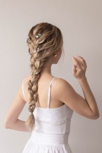 Flower braid ponytail tutorial for summer—an elegant, easy hairstyle with texture and floral accents.